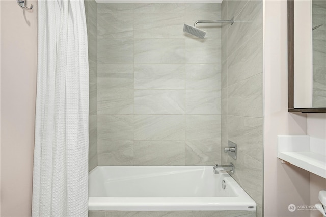 bathroom with shower / bathtub combination with curtain