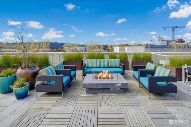 view of patio / terrace with an outdoor living space with a fire pit