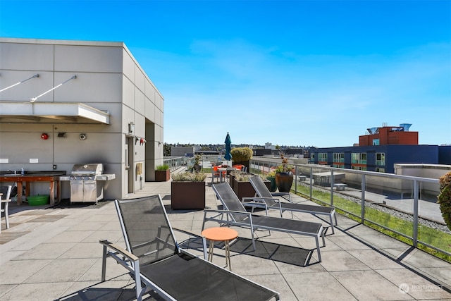 view of patio / terrace featuring area for grilling and sink