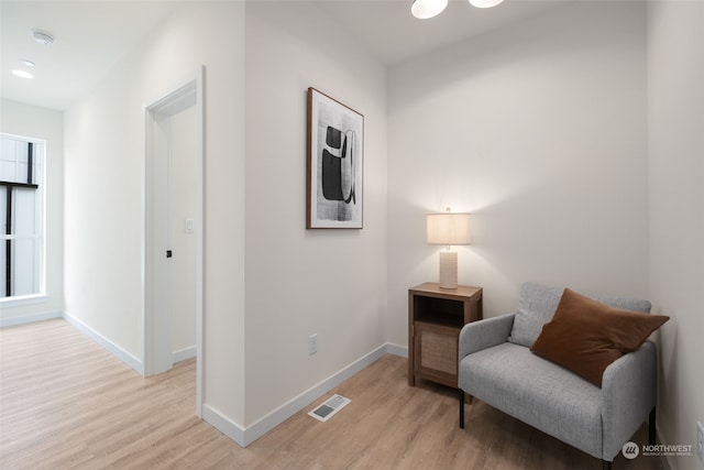 living area with light hardwood / wood-style floors