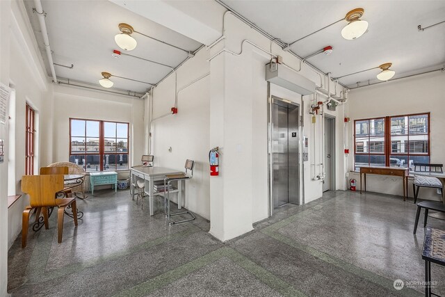 744 Market St Unit 202, Tacoma, WA 98402 - kitchen featuring elevator and speckle patterned floor