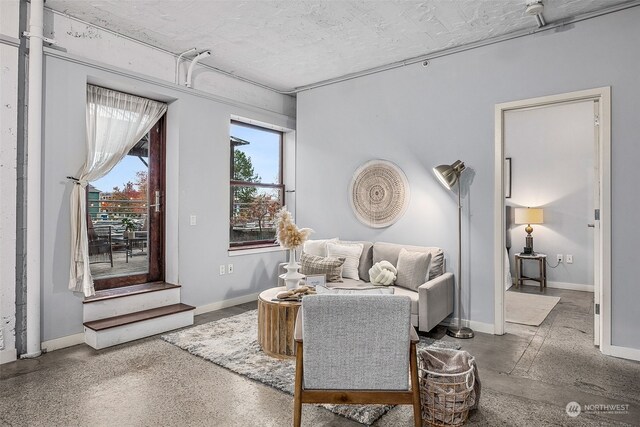744 Market St Unit 202, Tacoma, WA 98402 - living area featuring baseboards