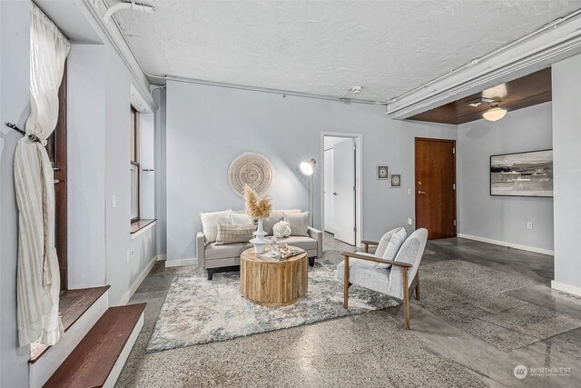 744 Market St Unit 202, Tacoma, WA 98402 - living area with a textured ceiling and baseboards