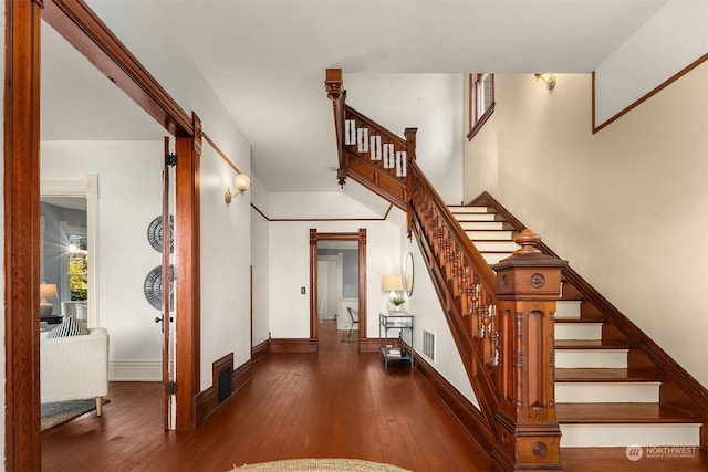 stairway featuring hardwood / wood-style floors