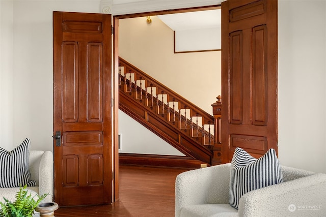 staircase featuring wood-type flooring