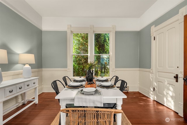 dining space with dark hardwood / wood-style floors