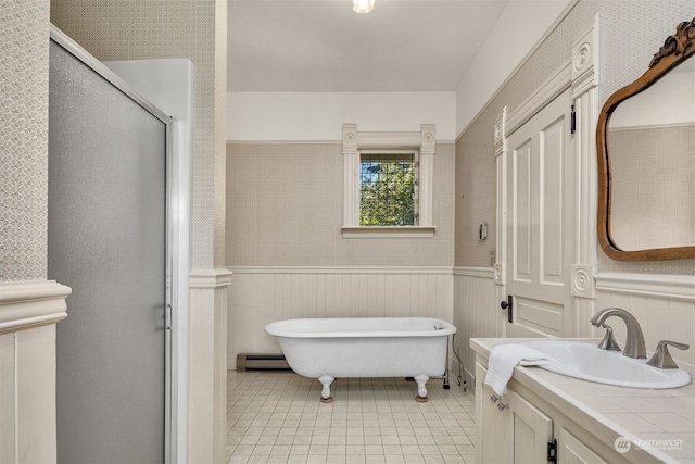 bathroom with a baseboard heating unit, wood walls, vanity, plus walk in shower, and tile patterned flooring