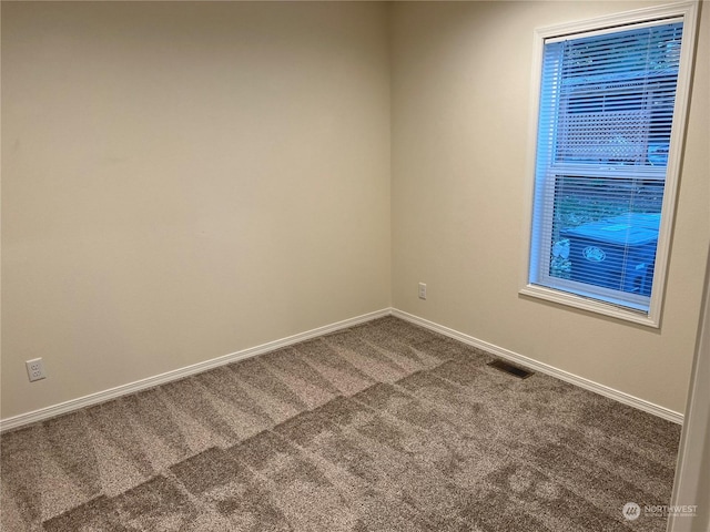 507 131st St E Unit L, Tacoma, WA 98445 - unfurnished room featuring visible vents, carpet flooring, and baseboards