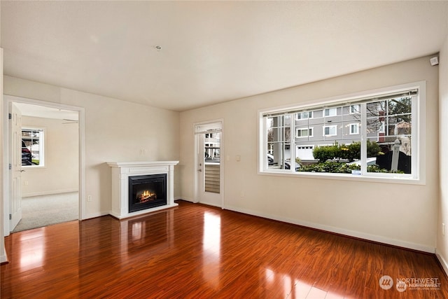 unfurnished living room featuring hardwood / wood-style flooring