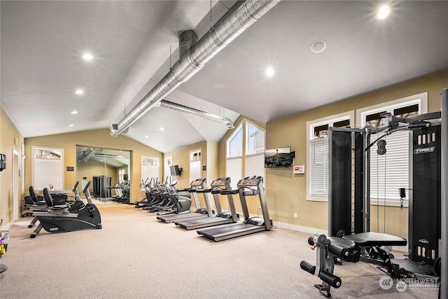 gym featuring vaulted ceiling