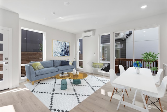 living room featuring a wall mounted AC and light wood-type flooring