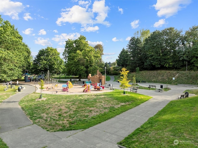 surrounding community featuring a yard and a playground