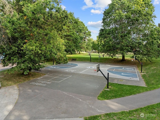 view of basketball court featuring a lawn