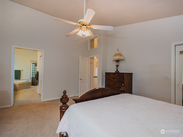 carpeted bedroom featuring high vaulted ceiling, connected bathroom, and ceiling fan