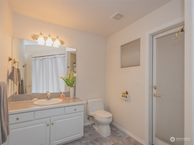 bathroom featuring vanity, toilet, and a shower with shower curtain