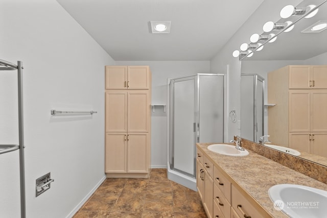 bathroom featuring vanity and an enclosed shower