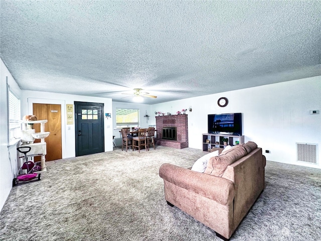 living room with carpet and a textured ceiling