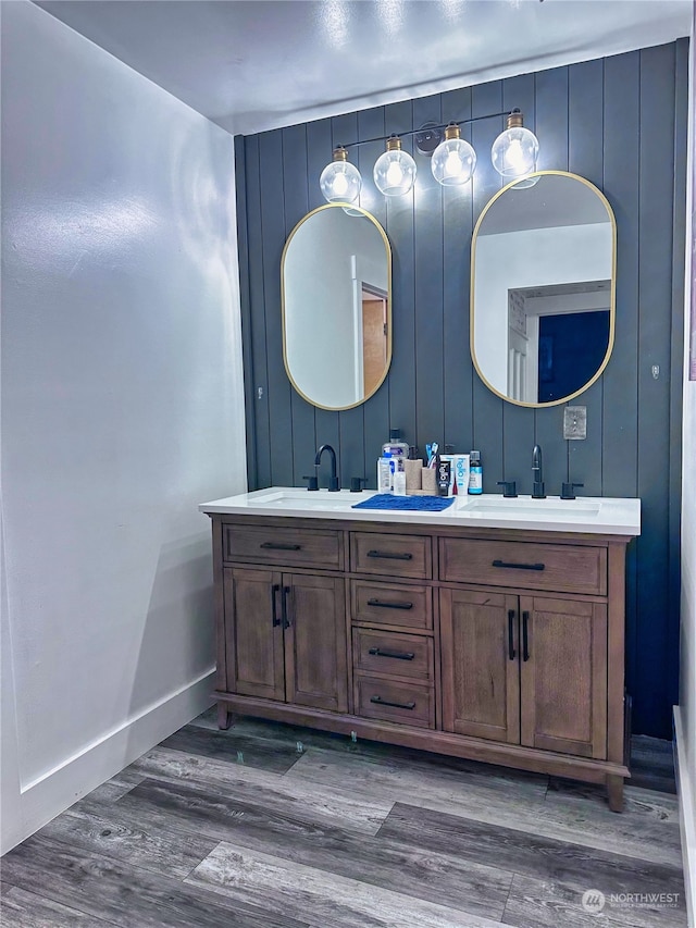 bathroom featuring vanity and wood-type flooring