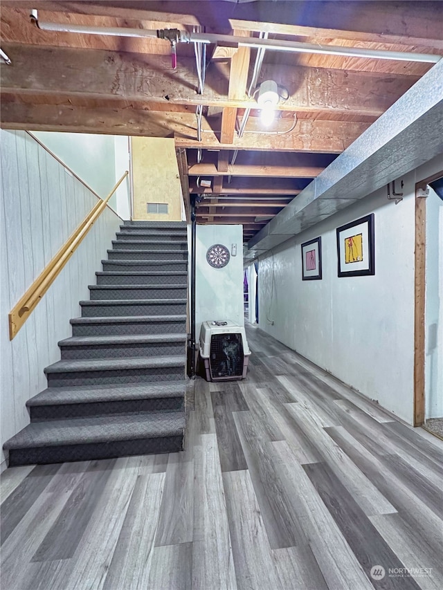 basement with hardwood / wood-style flooring