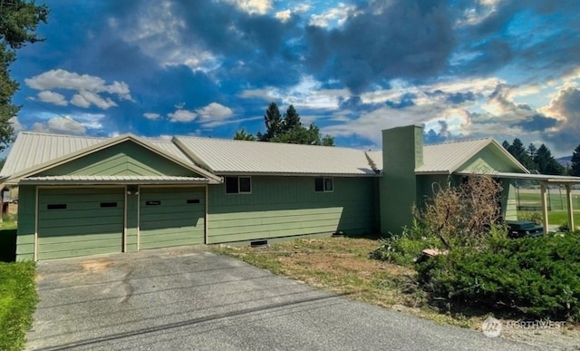 ranch-style house featuring a garage