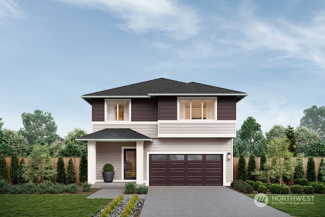 view of front of home featuring a front lawn and a garage