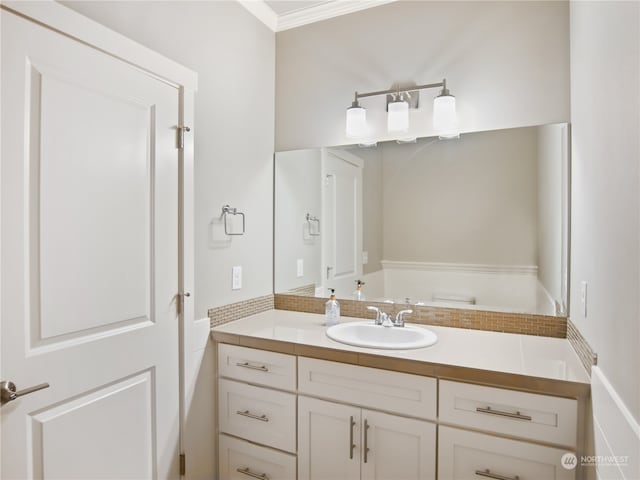 bathroom featuring vanity and crown molding