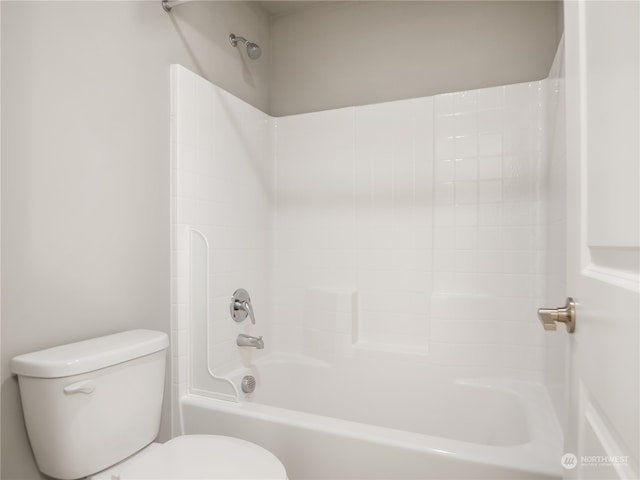 bathroom featuring toilet and  shower combination