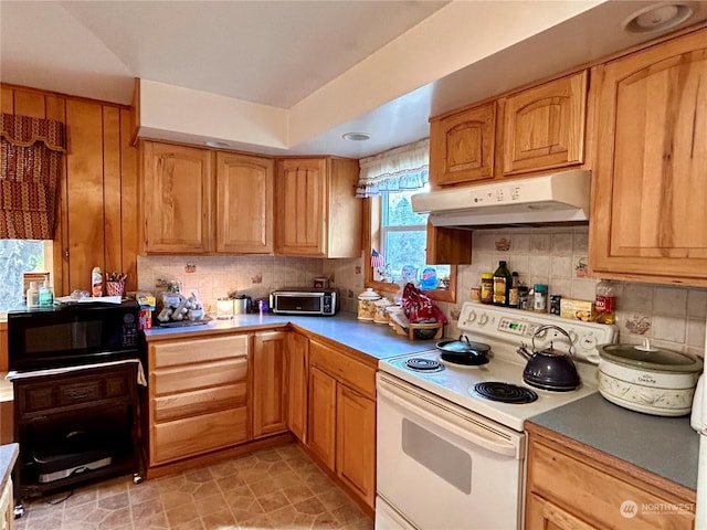 1410 E Sanpoil Rd, Keller, WA 99140 - kitchen with white electric stove, under cabinet range hood, black microwave, decorative backsplash, and light countertops