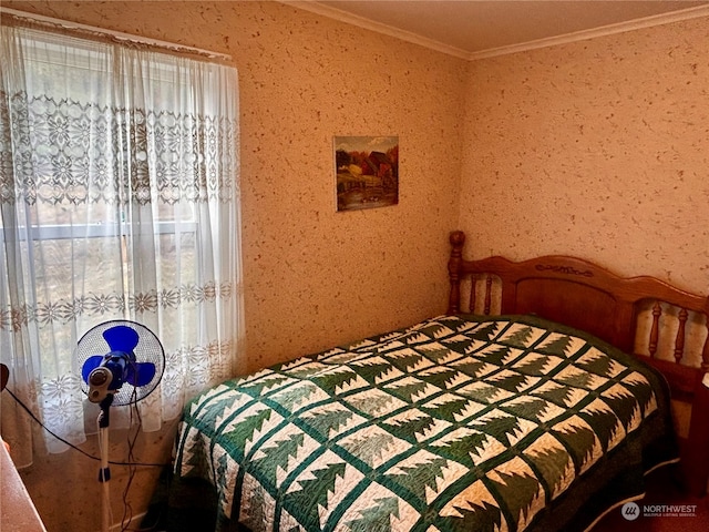 bedroom featuring multiple windows and crown molding