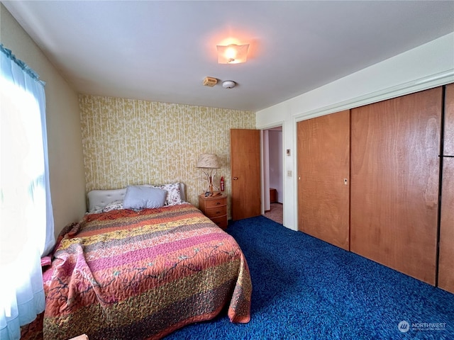 bedroom with carpet flooring and a closet