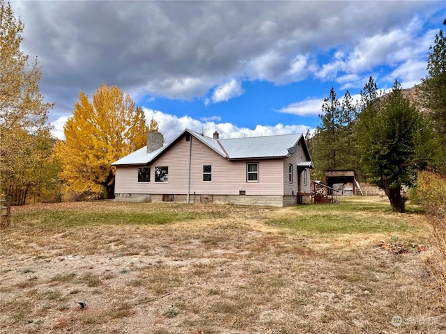 1410 E Sanpoil Rd, Keller, WA 99140 - view of side of home featuring a chimney and a lawn