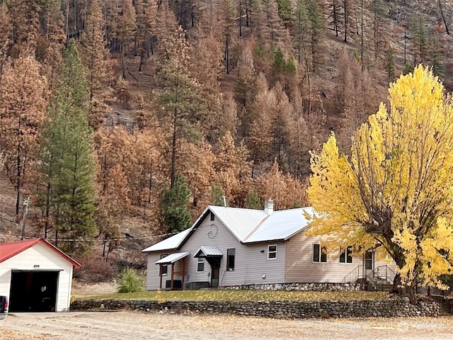 view of front facade with an outbuilding and a garage