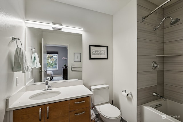 full bathroom with vanity, toilet, and tiled shower / bath