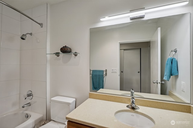 full bathroom with vanity, toilet, and tiled shower / bath