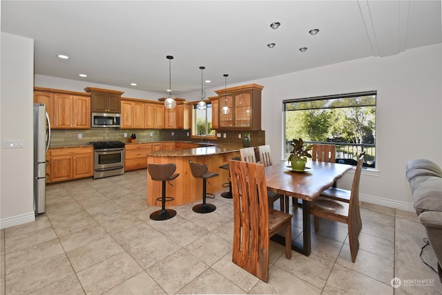 tiled dining area featuring sink