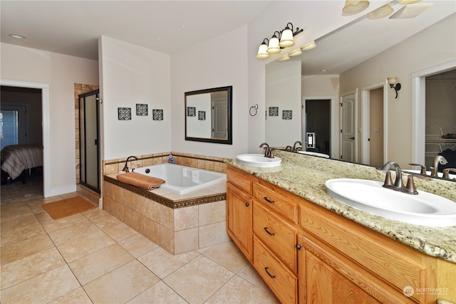 bathroom featuring vanity, separate shower and tub, and tile patterned flooring