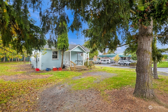 view of yard with covered porch