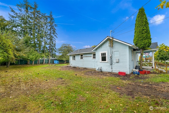 view of home's exterior featuring a yard