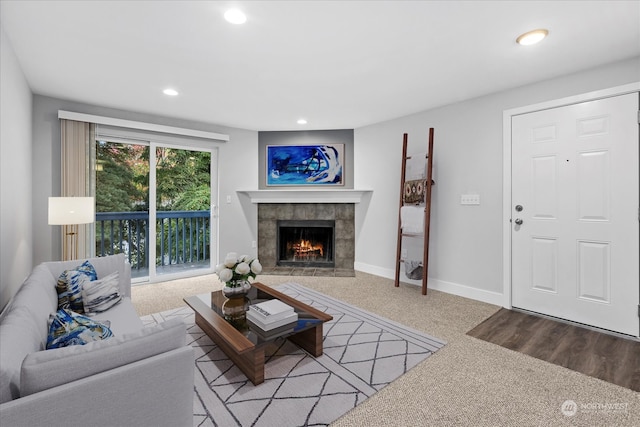 living room featuring carpet flooring and a fireplace