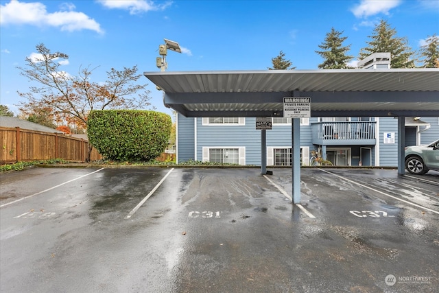 view of parking / parking lot with a carport