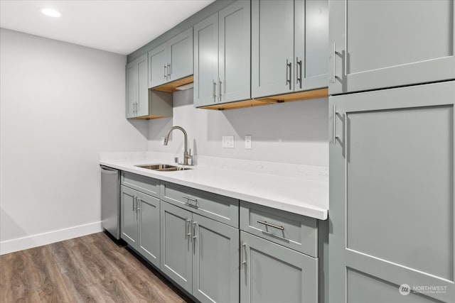 kitchen with gray cabinets, dark hardwood / wood-style floors, sink, and dishwasher