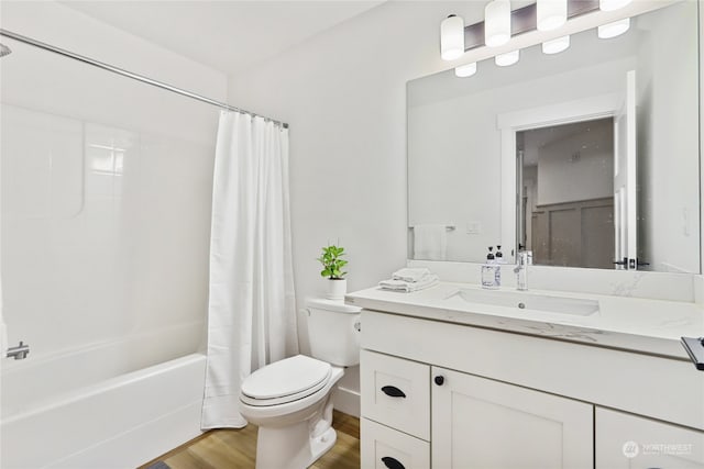 full bathroom with vanity, shower / bath combo with shower curtain, toilet, and wood-type flooring