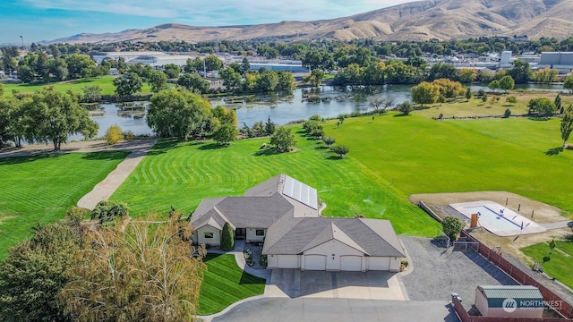 bird's eye view with a water and mountain view