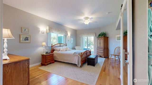 bedroom featuring light hardwood / wood-style floors and ceiling fan