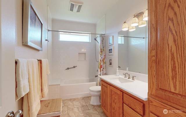 full bathroom featuring vanity, toilet, and shower / tub combo