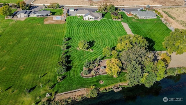 drone / aerial view with a water view and a rural view