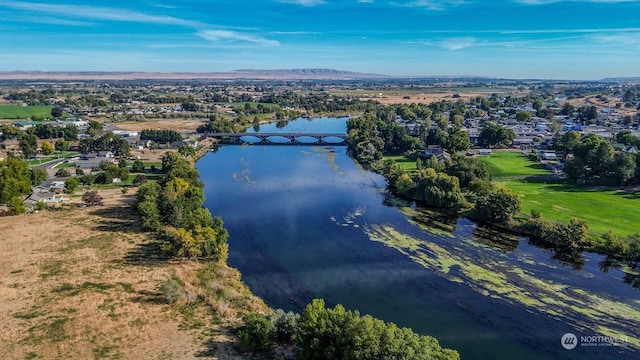 birds eye view of property featuring a water and mountain view