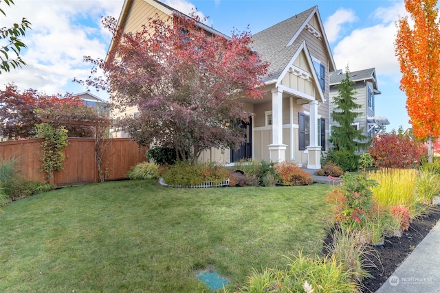 view of side of property with a yard