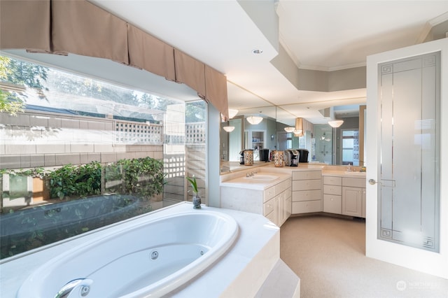 bathroom featuring vanity, ornamental molding, and tiled tub