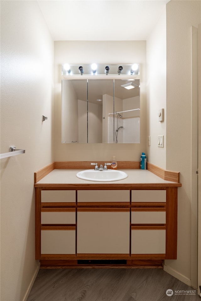 bathroom featuring vanity and wood-type flooring